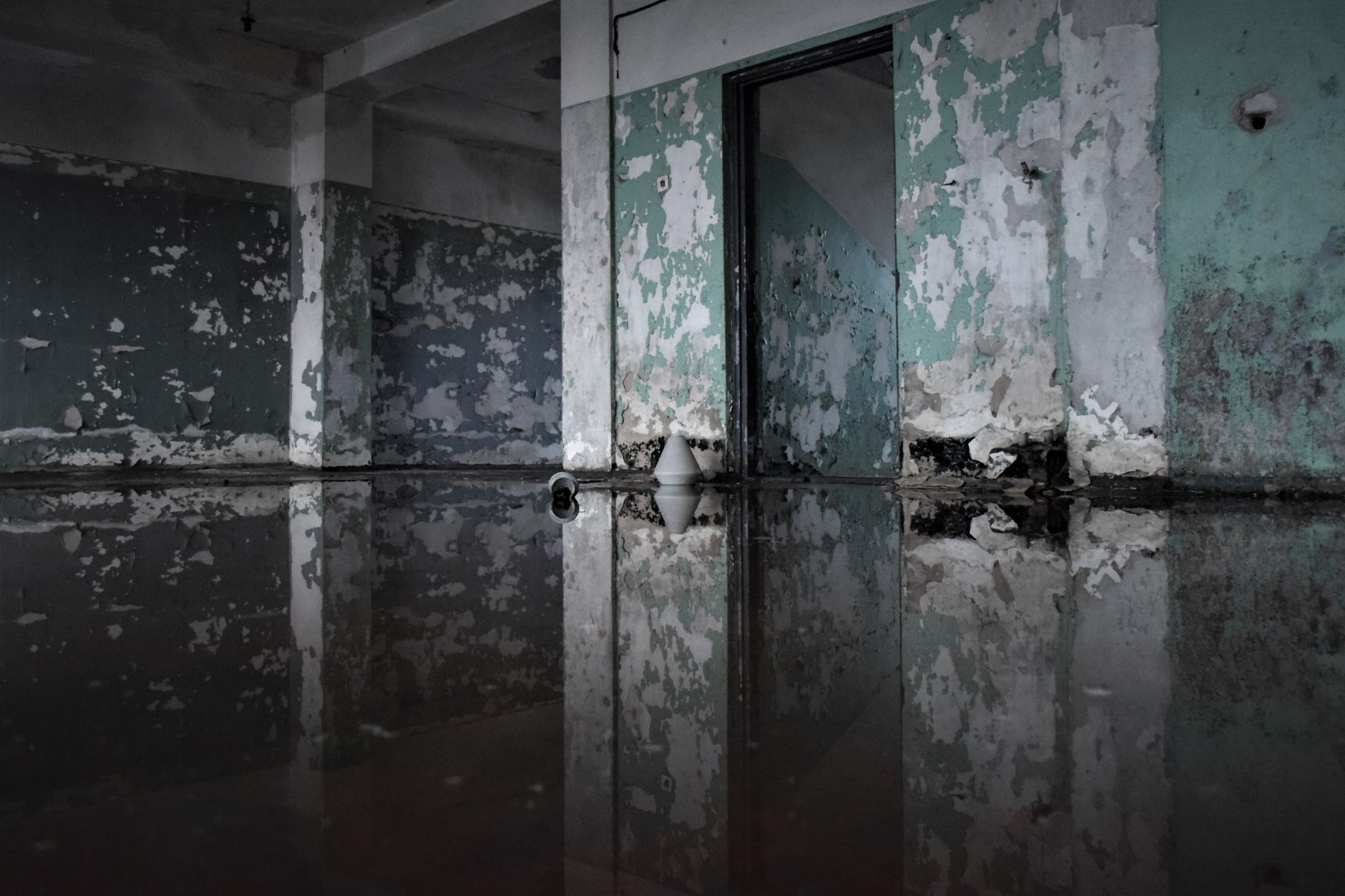 Standing water across the floor of a New Orleans home after a leak