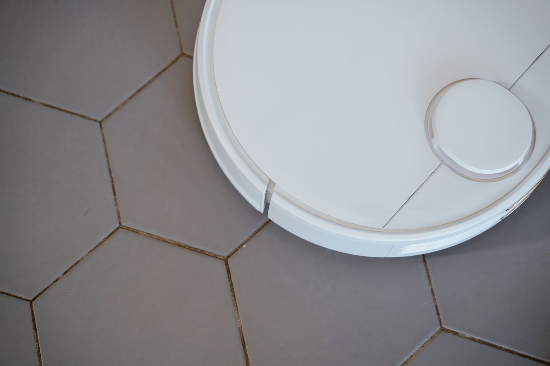 Professional deep cleaning a tile floor in a New Orleans home